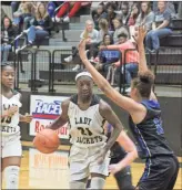  ?? Kevin Myrick ?? Left: Lauryn Clark looks for an opening to pass against the Gordon Central defense in the Lady Jackets win on Friday, Dec. 6. Right: Rockmart’s Keyarah Berry put up 47 points on Gordon Central in a big win for the Lady Jackets on Friday, Dec. 6.