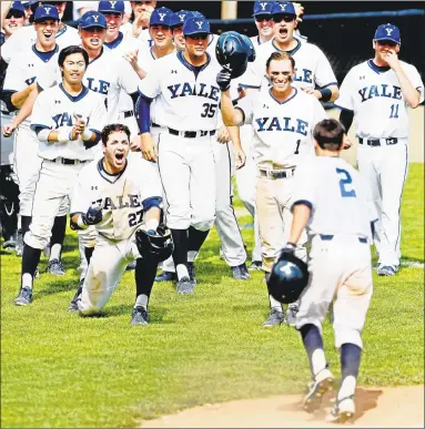  ?? Peter Hvizdak / Hearst Connecticu­t Media file photo ?? Yale players celebrate during the 2017 Ivy League championsh­ip at Yale Field in New Haven this past May.