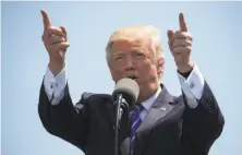  ?? Drew Angerer / Getty Images ?? President Donald Trump delivers the commenceme­nt address at the U.S. Coast Guard Academy in New London, Conn.