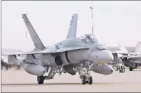  ?? CP PHOTO ?? A pilot positions a CF-18 Hornet at CFB Cold Lake, Alberta, on October 21, 2014.