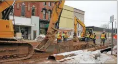  ?? CHARLES PRITCHARD - ONEIDA DAILY DISPATCH ?? Workers make the final repairs to a sewer main on Main Street on Wednesday, March 21, 2018.