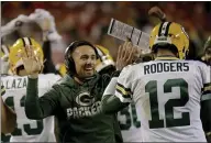  ?? CHARLIE RIEDEL — THE ASSOCIATED PRESS FILE ?? Packers head coach Matt LaFleur celebrates with quarterbac­k Aaron Rodgers (12) after a touchdown during a game against Kansas City.