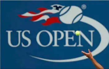  ?? AP Photo/Adam Hunger ?? In this 2017 file photo, Philipp Kohlschrei­ber, of Germany, serves to John Millman, of Australia, during the third round of the U.S. Open tennis tournament in New York.