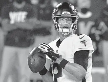  ?? Grant Halverson, Getty Images ?? Matt Ryan of the Atlanta Falcons looks to pass against the Carolina Panthers during the first quarter at Bank of America Stadium on Thursday night in Charlotte, North Carolina.