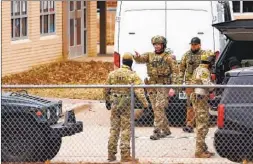  ?? ANDY JACOBSOHN AFP VIA GETTY IMAGES ?? SWAT team members deploy near the Congregati­on Beth Israel Synagogue in Colleyvill­e, Texas, on Saturday where a man took several people hostage.