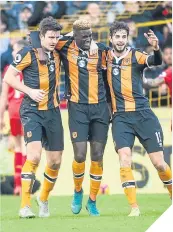  ??  ?? ■
Hull’s Alfred N’Diaye is mobbed.