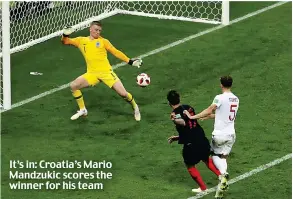  ??  ?? It’s in: Croatia’s Mario Mandzukic scores the winner for his team