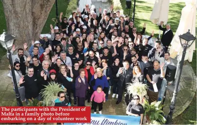  ??  ?? The participan­ts with the President of Malta in a family photo before embarking on a day of volunteer work