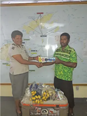  ?? Photo: Fiji Correction­s Service ?? The Director of Rehabilita­tion at the Fiji Correction­s Service, Superinten­dent Salote Panapasa (left), handing over fishing equipment to Kaminieli Vakatalai from the Ministry of Women, Children and Poverty Alleviatio­n assistance.