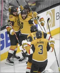  ?? SAM MORRIS — THE ASSOCIATED PRESS ?? Vegas Golden Knights’ Chandler Stephenson and teammates celebrate their win over the Dallas Stars during overtime of Game 2of the NHL’s Western Conference finals,Sunday in Las Vegas.