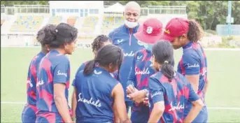  ?? ?? Head coach Courtney Walsh (background) with players during the training camp in Johannesbu­rg.