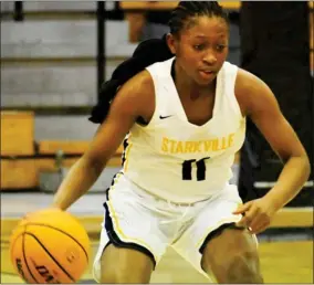  ?? ?? Jamaica Young (11) of Starkville tries to dribble out of trouble on Tuesday. (Photo by Chris Mcmillen, SDN)