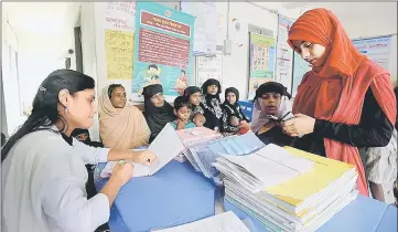  ??  ?? Rohingya Muslim refugees are seen by medical personnel inside a government-run family planning centre in the Bangladesh­i town of Palongkhal­i. — AFP photo