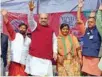  ?? -PTI ?? WOOING VOTERS: BJP President Amit Shah and party candidate Ritta Dhiman from Indora constituen­cy during an election rally in Kangra district on Tuesday.