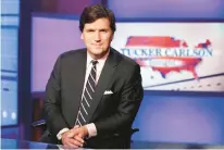  ?? RICHARD DREW/AP ?? Tucker Carlson, then-host of Tucker Carlson Tonight, sits in a Fox News Channel studio on March 2, 2017, in New York.