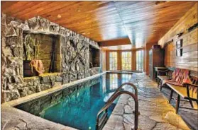  ??  ?? AMENITIES INCLUDE an indoor swimming pool and a sauna. The tri-level house in Utah’s Deer Valley sold for $11.6 million.