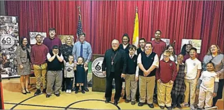  ?? SUBMITTED PHOTO ?? Archbishop Charles Chaput, center, poses with students of the special needs schools in the Archdioces­e of Philadelph­ia Thursday during the launch of this year’s Catholic Charities Appeal. The event was held at St. Katherine Day School in Wynnewood, one...