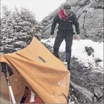  ?? Provided by DEC ?? Rangers set upa makeshift shelter near the top of Mt. Marcy to protect an injured hiker who that night was carried down the mountain.