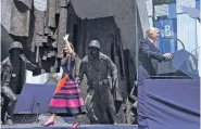  ?? STEPHEN CROWLEY THE NEW YORK TIMES ?? First lady Melania Trump waves to the crowd as President Donald Trump speaks Thursday at Krasinski Square in Warsaw, Poland.