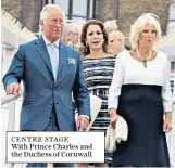  ??  ?? CENTRE STAGE With Prince Charles and the Duchess of Cornwall