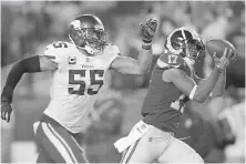  ??  ?? Rams receiver Robert Woods hauls in a TD pass in front of Vikings linebacker Anthony Barr during the second half.