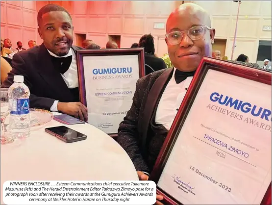  ?? ?? WINNERS ENCLOSURE . . . Esteem Communicat­ions chief executive Takemore Mazuruse (left) and The Herald Entertainm­ent Editor Tafadzwa Zimoyo pose for a photograph soon after receiving their awards at the Gumiguru Achievers Awards ceremony at Meikles Hotel in Harare on Thursday night