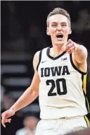  ?? GRACE SMITH/GETTY IMAGES ?? Iowa’s Payton Sandfort reacts after a Hawkeye basket during Tuesday’s victory over Penn State. Sandfort became the first player in Iowa men’s basketball history to record a triple-double.