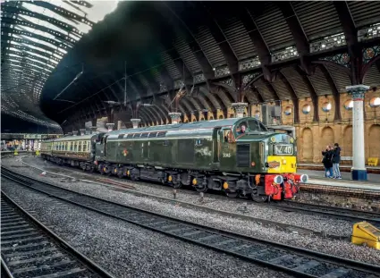  ?? GEOFF GRFFITHS ?? WHISTLING UNDER THE ROOF: The Class 40 Preservati­on Society’s No. D345 (40145) arrives at York with ‘The Whistling Geordie’ Pathfinder Tours charter from Burton-upon-Trent to Newcastle on November 12.