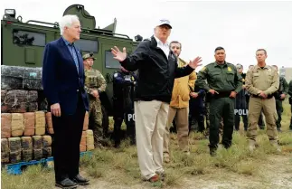  ??  ?? MAGA CHAOS Trump visits McAllen, where his wall has lawenforce­ment critics. “It’s worthless,” says San Juan’s police chief. “Give us a couple million for enforcemen­t, and we can do better.”