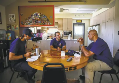  ?? Photos by Yalonda M. James / The Chronicle ?? East Contra Costa firefighte­rs Jared Gavard (left), Capt. Robert Ruddick and Dr. Malcolm Johnson wait for calls at Station 52, one of three that serve 128,000 people.