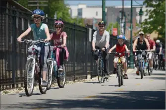  ?? NWA Democrat-Gazette/BEN GOFF @NWABENGOFF ?? CYCLISTS START THE BIKE TO BAUM RIDE on Sunday May 1, 2016 on the greenway trail near Dickson Street in downtown Fayettevil­le.