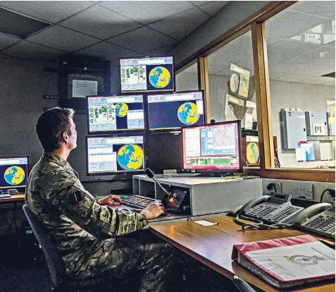  ??  ?? Inside the home of Britain’s ballistic missile early warning system, where radars can detect and track threats. Above left, the emergency trip console for the station