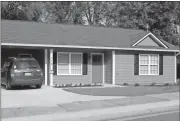  ?? Doug Walker / Rome News-Tribune ?? Clayton Pugh and his wife Ashley Stringer have purchased the first of five homes on Wilson Avenue built with a funds from a grant from the Georgia Department of Community Affairs. The repayments will go into a fund to build additional quality...