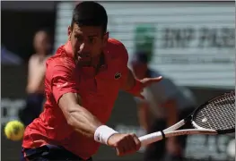  ?? THIBAULT CAMUS — THE ASSOCIATED PRESS ?? Novak Djokovic plays a shot against Juan Pablo Varillas during their fourth-round match at the French Open on Sunday. The 6-3, 6-2, 6-2win sent Djokovic to the quarterfin­als.