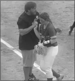  ?? Photo by Gerren Smith ?? STAYING ENCOURAGED: Magnet Cove softball head coach Hunter Vincent keeps the encouragem­ent progressin­g for productive play each time the infielders step off the field between innings.