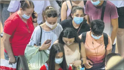  ?? ANDREA COMAS — THE ASSOCIATED PRESS ?? People crowd the commuter train platforms at Atocha station in Madrid, Spain, Thursday, Aug. 27, 2020. Authoritie­s in Madrid, the hottest spot in Spain’s new surge of coronaviru­s contagion, said Wednesday they only consider very localized stay-at-home orders for the worst-hit areas of the Spanish capital, discarding the idea locking down the city of 3.3 million.