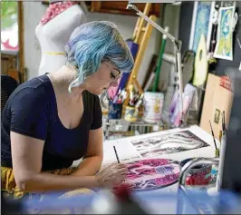  ?? GEORGE WALKER IV/ASSOCIATED PRESS ?? Artist Kelly Mckernan paints in their studio Aug. 15 in Nashville, Tenn. Mckernan is an artist and one of three plaintiffs in a lawsuit against artificial intelligen­ce companies they allege have infringed on their copyright.