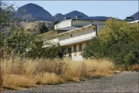  ?? MATT YORK — ASSOCIATED PRESS FILE PHOTO ?? In this Thursday, Nov. 11, 2004 file photo, the Mountain View Officers’ Club, built in 1942, is shown, at Ft. Huachuca, Ariz. The structure is the last of over 14,000 wooden structures built at the fort to house, train,and care for black soldiers preparing for World War II. Once slated for destructio­n, efforts are now underway to restore the building to its WWII condition.