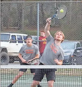  ?? Scott Herpst ?? Ben Maanum watches as his doubles partner, Anthony Collins, puts away a shot during their match against Dade County on Wednesday. LaFayette’s boys won the match in a 5-0 sweep.