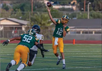  ?? File art ?? Canyon junior quarterbac­k Aydyn Litz throws a deep ball in a game against San Fernando at Harry Welch Stadium on Friday, Aug. 24.