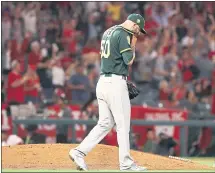  ?? VICTOR DECOLONGON — GETTY IMAGES ?? Mike Fiers, who came on in the second inning in the A’s bullpen game Friday, was roughed up in 3 1⁄3 innings against the Angels.
