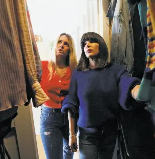  ??  ?? Pickett (right) and Riedl discuss Riedl’s closet: “Making massive cuts to a wardrobe can be hard so having a person you can trust, with an expert eye, to help make decisions is key,” Pickett says.