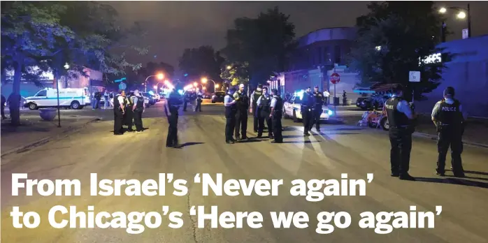  ?? MITCHELL ARMENTROUT/ SUN- TIMES ?? Officers at the scene of a police- involved shooting in the 300 block of East 47th Street that left a man dead. His was one of three deaths that led Pastor Christophe­r Harris Sr. to cut short a trip to Israel this month and return for their funerals in...