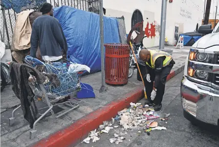  ?? HARRISON HILL/USA TODAY ?? Every day, supervisor James Blackwell and other maintenanc­e crew members have to clean up “hot spots,” areas in the industrial district of Los Angeles where large amounts of trash pile up.