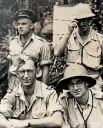  ??  ?? Vahry, front left, with fellow officers, and one of his photos depicting the conditions during the campaign to oust the Japanese from the Pacific.