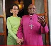  ??  ?? Nobel Peace Prize laureates Archbishop Emeritus Desmond Tutu and Suu Kyi at her home in Yangon, Myanmar, in 2013.