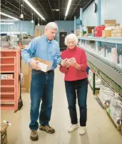  ?? OLIVER PARINI/THE NEW YORK TIMES ?? Ann Clark stands Dec. 11 with her son, Ben, at their cookiecutt­er factory in Rutland, Vermont. Ann started the company in 1989 with her husband, John, and Ben joined nearly a decade later.