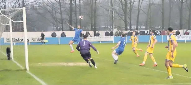  ?? Frank Crook ?? ●● Ramsbottom apply pressure on the Radcliffe defence during the 2-1 win at the Harry Williams Riverside Stadium. Match report inside