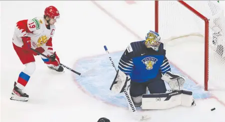  ?? CODIE MCLACHLAN/GETTY IMAGES ?? Russian Vasili Podkolzin, seen taking on goaltender Kari Piiroinen and Finland at the world junior championsh­ip Jan. 5 in Edmonton, is still on the roster for SKA St. Petersburg. There were some reports that he was demoted until his KHL contract expires on April 30.