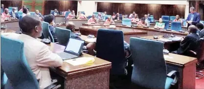  ?? (Pics: Sabelo Majola) ?? Minister of Finance Neal Rijkenberg (standing) making his submission­s in Parliament yesterday.